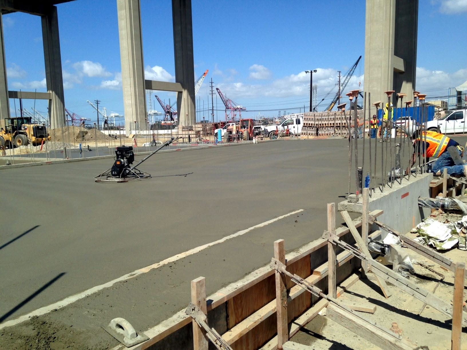 Freshly poured concrete slab on grade at a construction site